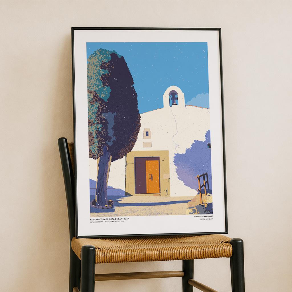 Lámina de la ermita de Sant Joan en La Serratella enmarcada, apoyada sobre una silla de enea